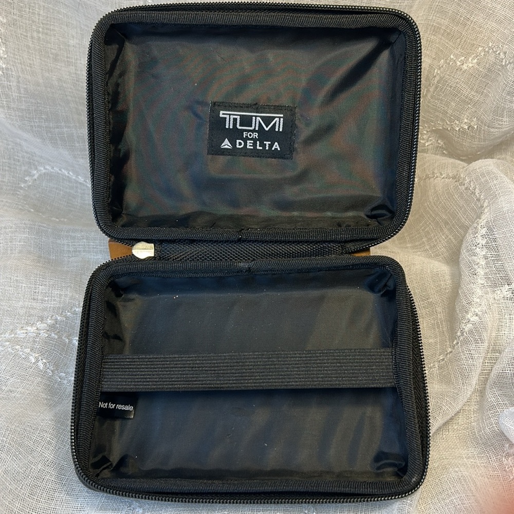 Tumi hard case luggage cosmetic bag filled with goodies for your next trip - Picture 10 of 10